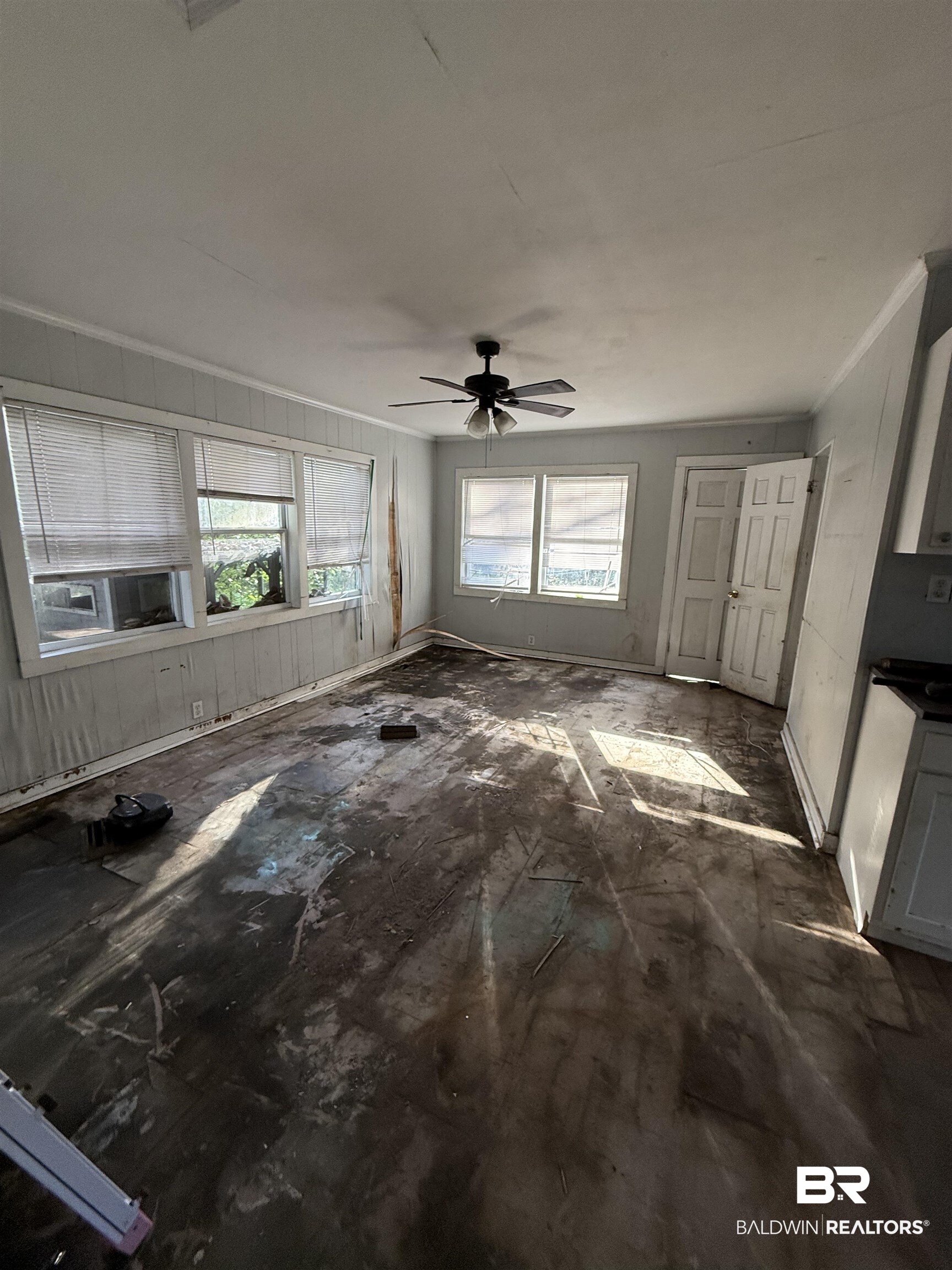 352 South Ann Street Mobile, AL 36604 - Photo 7 of 20 Unfurnished living room featuring ceiling fan, ornamental molding, and cooling unit