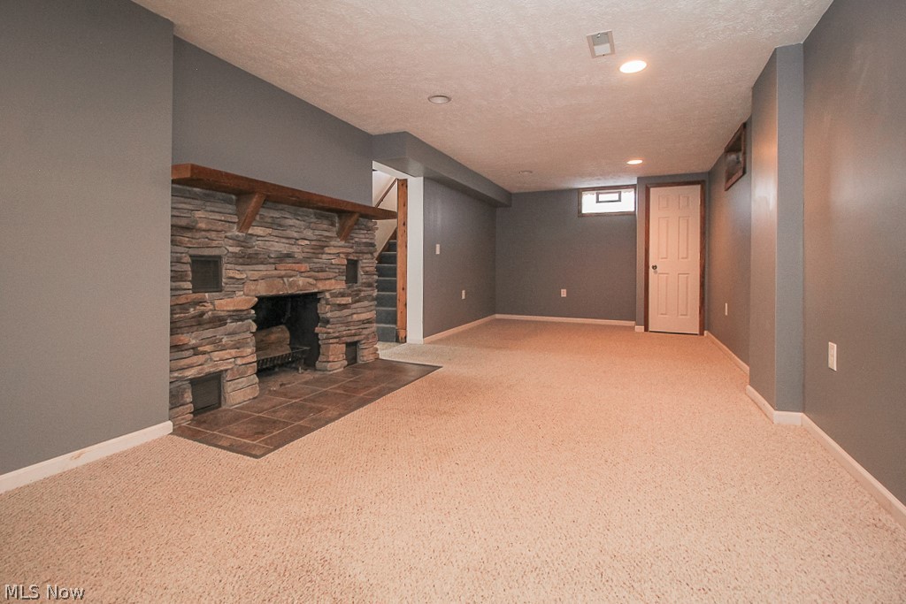 11988 Robson Road Grafton, OH 44044 - Photo 22 of 35 Beautiful stacked stone fireplace with barn wood mantel.