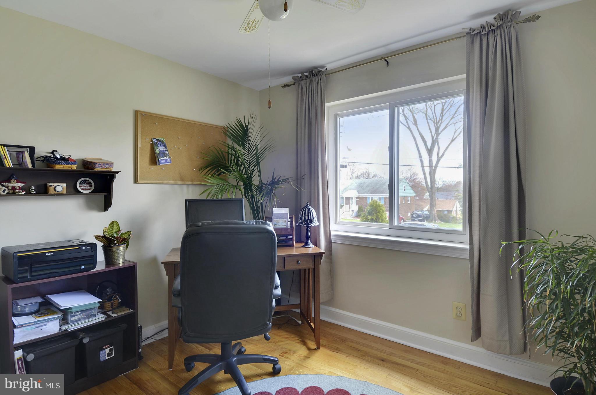 5912 Craig Street Springfield, VA 22150 - Photo 12 of 24 a view of a workspace with furniture and a window