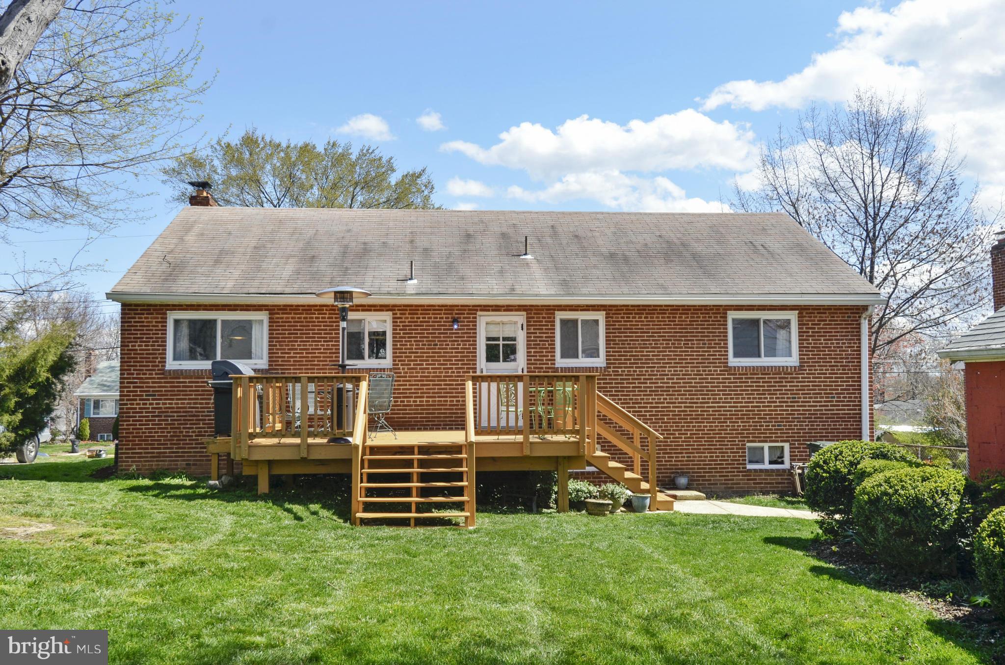 5912 Craig Street Springfield, VA 22150 - Photo 19 of 24 a view of a house with a yard