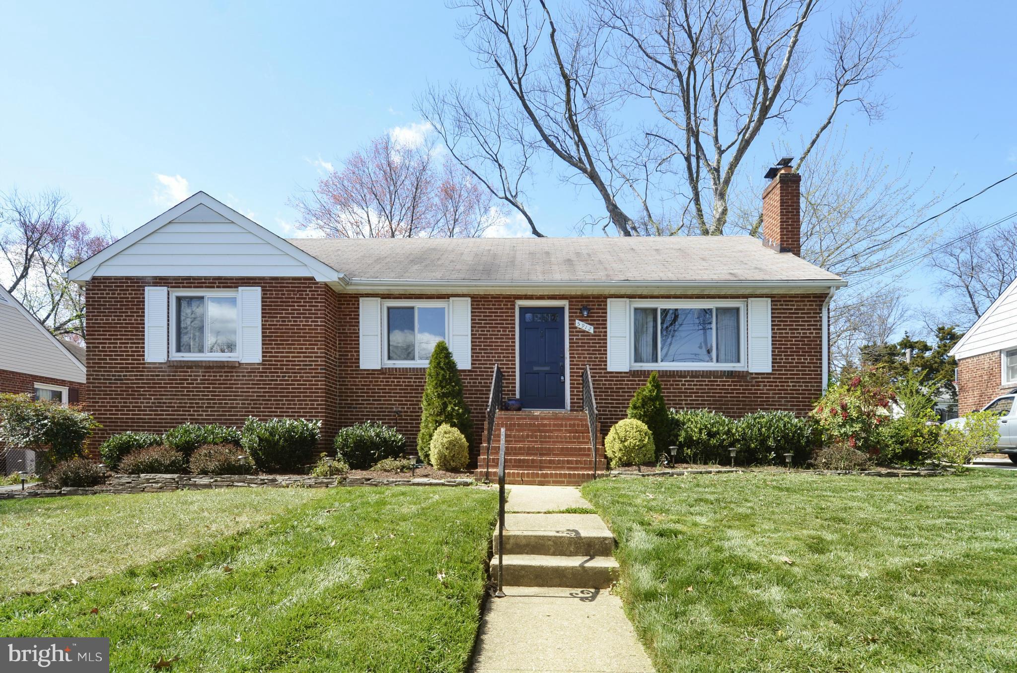 5912 Craig Street Springfield, VA 22150 - Photo 22 of 24 a front view of a house with garden