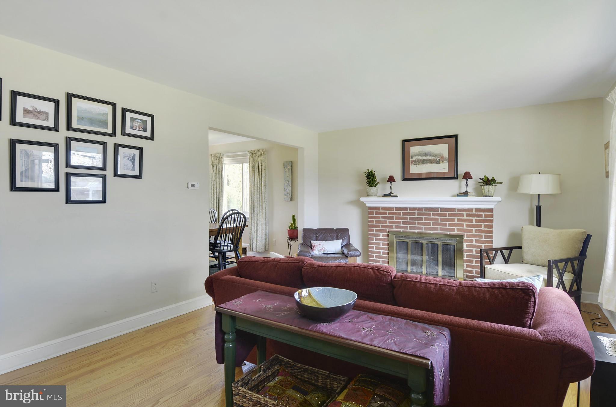 5912 Craig Street Springfield, VA 22150 - Photo 6 of 24 a living room with furniture and a fireplace