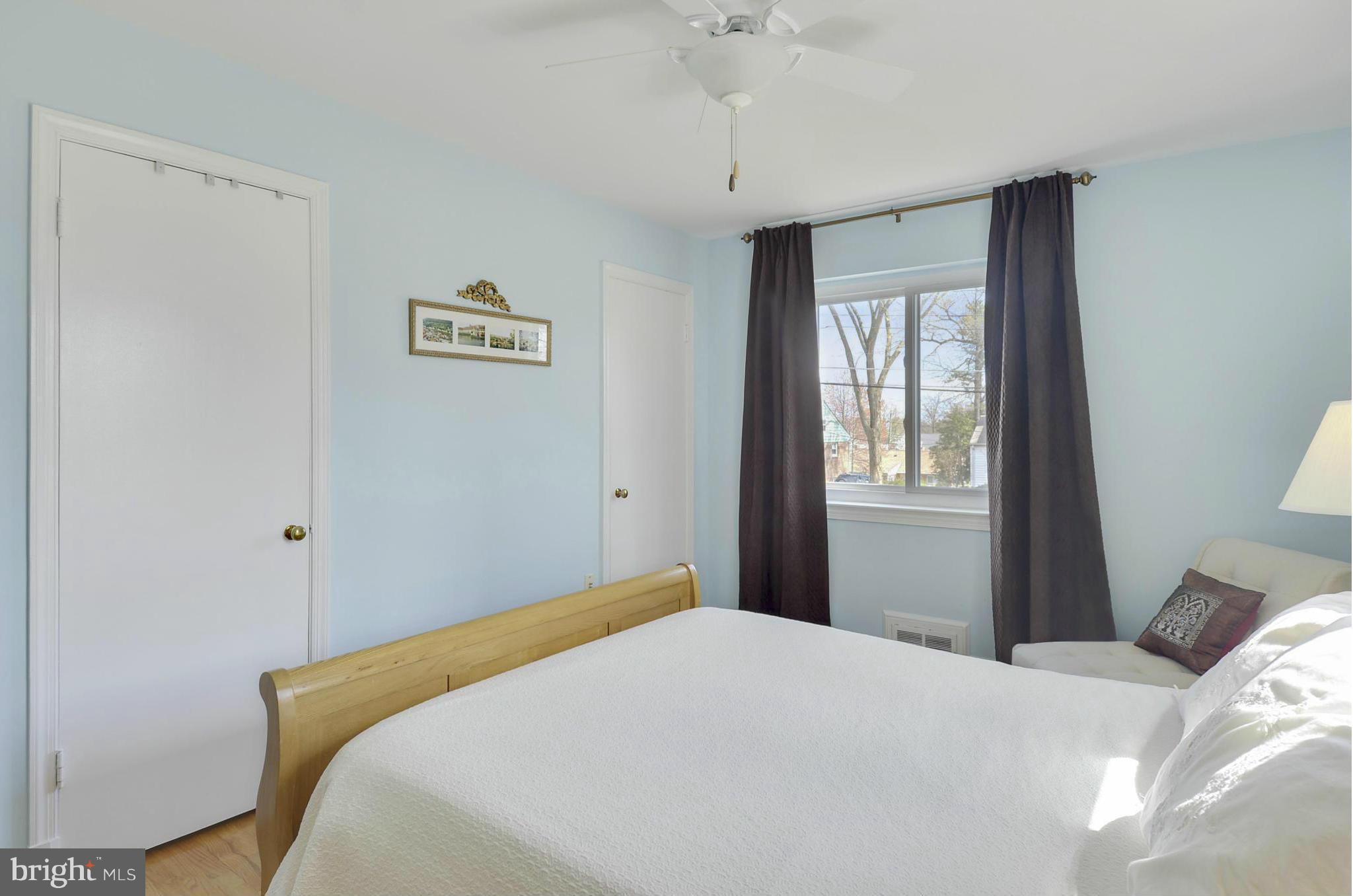 5912 Craig Street Springfield, VA 22150 - Photo 9 of 24 a bedroom with a bed and a window