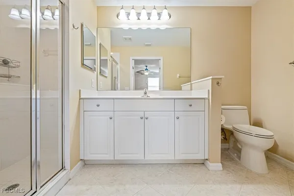 a bathroom with a double vanity sink and mirror