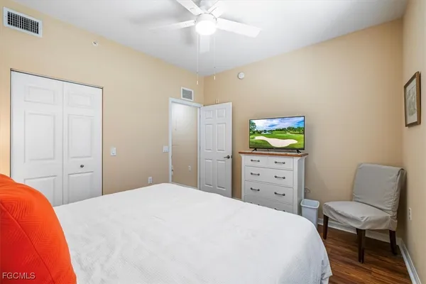 a bathroom with a sink and mirror with toilet