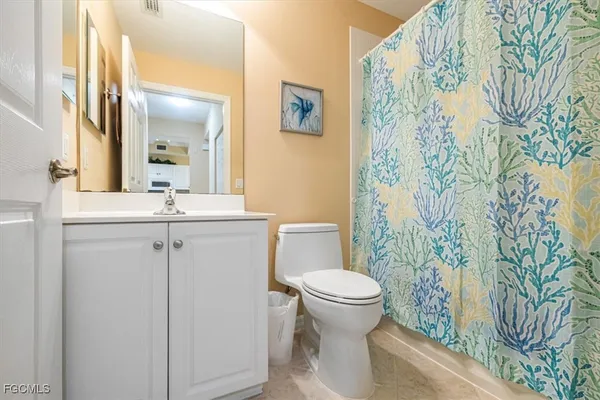 a utility room with cabinets washer and dryer
