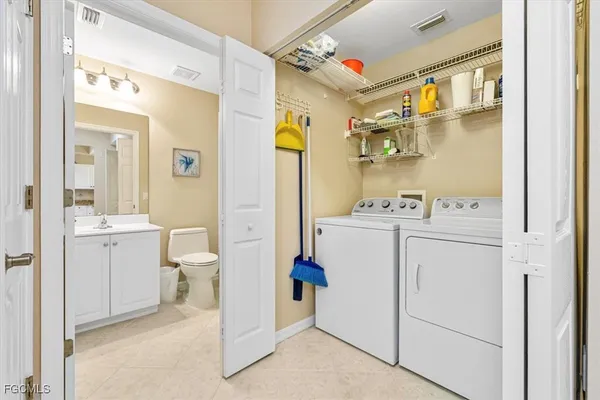 a utility room with dryer and washer