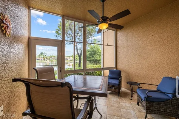 a view of a dining room with furniture window and outside view