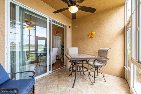 a view of a chairs and table in a patio