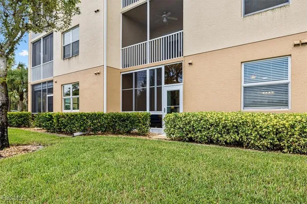 a view of a lake with houses in the back