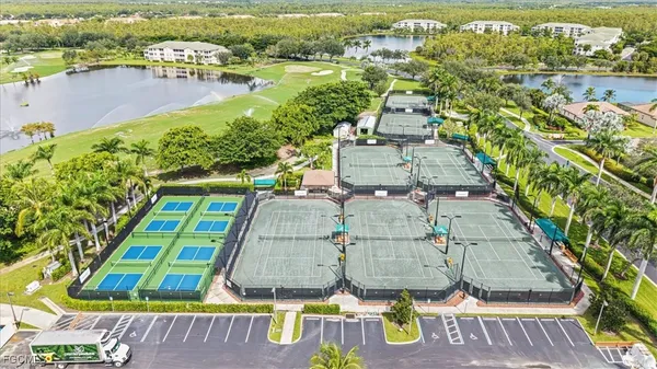 an aerial view of a house with a swimming pool yard and outdoor seating