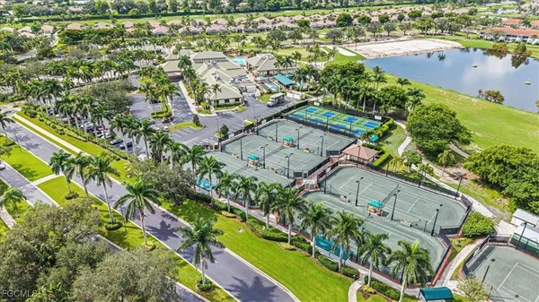 a living room with lots of furniture and a large window