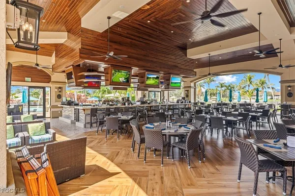 a view of a patio with couches and potted plants