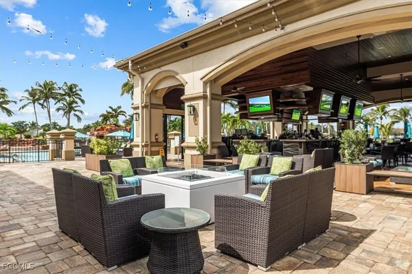 a picture of a bench in front of a wall