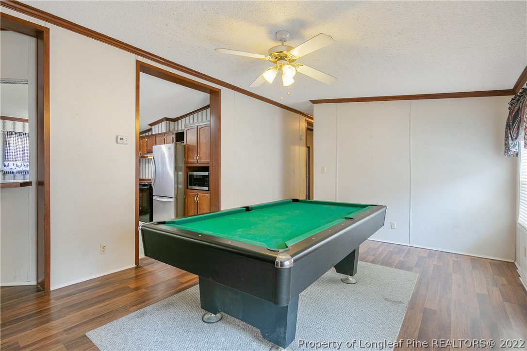 922 Magnolia Church Road Stedman, NC 28391 - Photo 23 of 49 a room with pool table and wooden floor