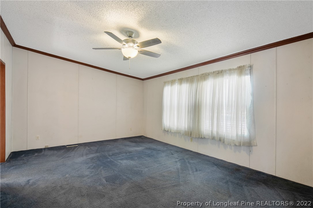 922 Magnolia Church Road Stedman, NC 28391 - Photo 24 of 49 a view of an empty room with a window