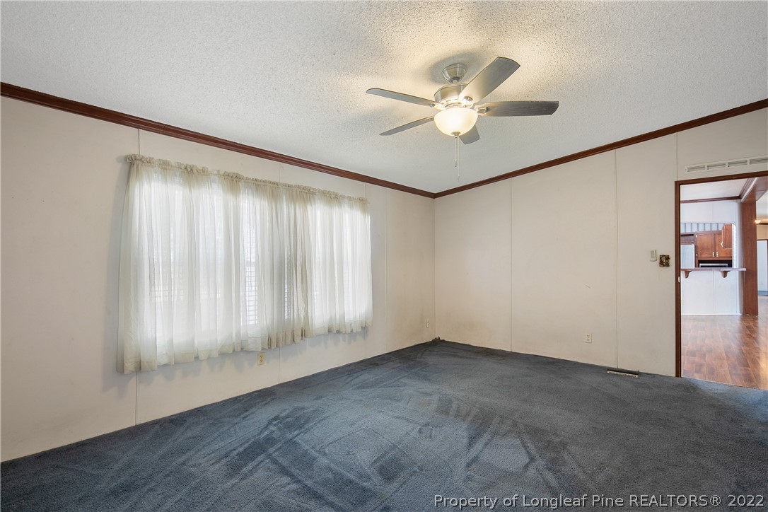 922 Magnolia Church Road Stedman, NC 28391 - Photo 25 of 49 a view of an empty room with a window