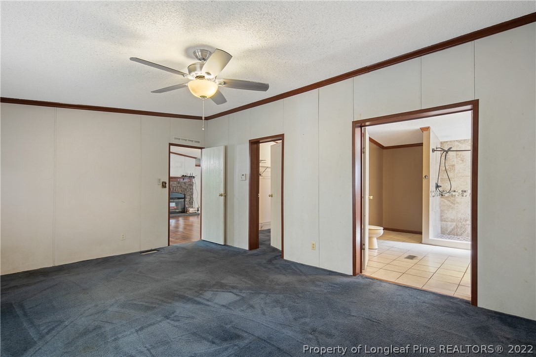 922 Magnolia Church Road Stedman, NC 28391 - Photo 26 of 49 a view of empty room with a ceiling fan