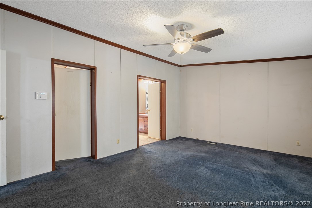 922 Magnolia Church Road Stedman, NC 28391 - Photo 27 of 49 a view of an empty room with a ceiling fan