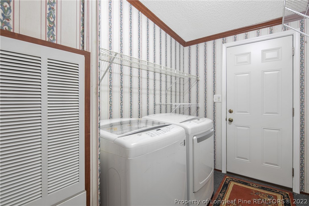 922 Magnolia Church Road Stedman, NC 28391 - Photo 37 of 49 a utility room with dryer and washer