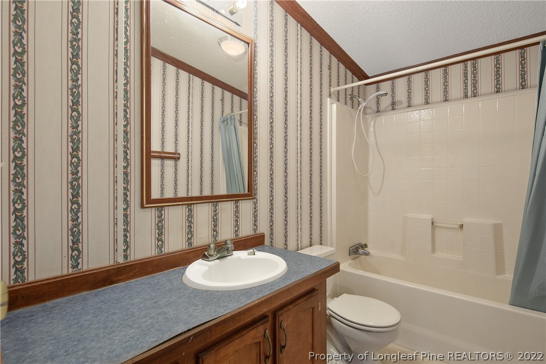 922 Magnolia Church Road Stedman, NC 28391 - Photo 41 of 49 a bathroom with a sink toilet and shower