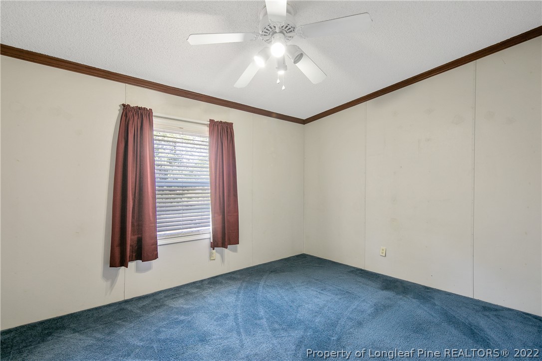 922 Magnolia Church Road Stedman, NC 28391 - Photo 42 of 49 an empty room with windows and fan