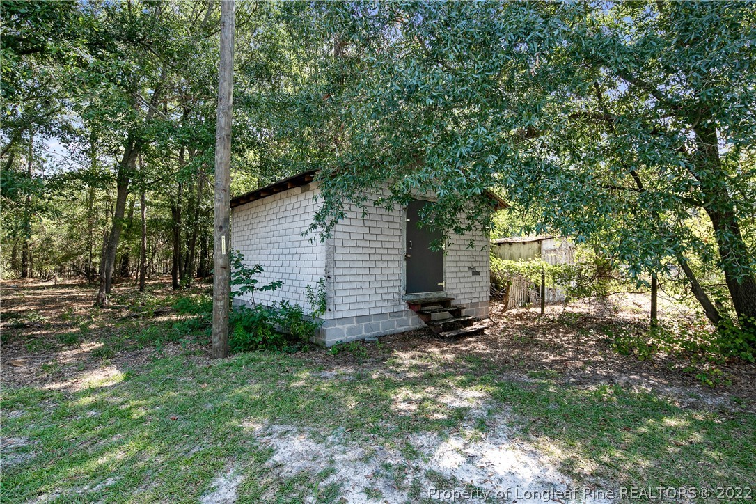 922 Magnolia Church Road Stedman, NC 28391 - Photo 49 of 49 a view of a house with a yard and tree