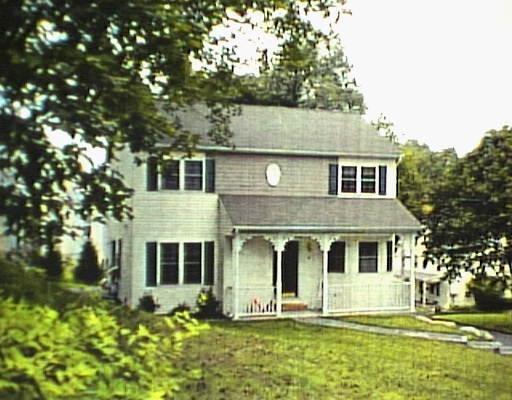 32 Abbott Avenue Ridgefield, CT 06877 - Photo 1 of 1 a front view of a house with a yard