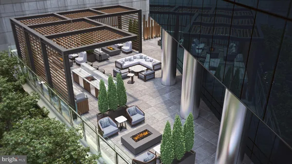 a backyard of a house with outdoor seating