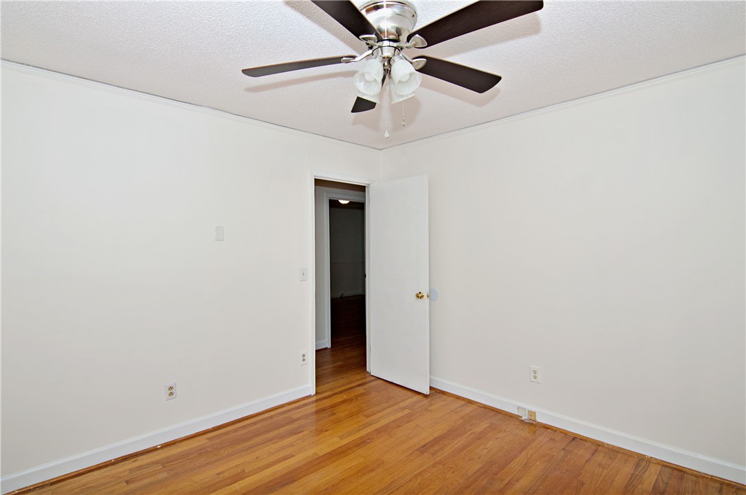 102 Broad Street Clemson, SC 29631 - Photo 23 of 40 Hardwood floors and a ceiling fan create a comfortable and inviting atmosphere in this flexible room.