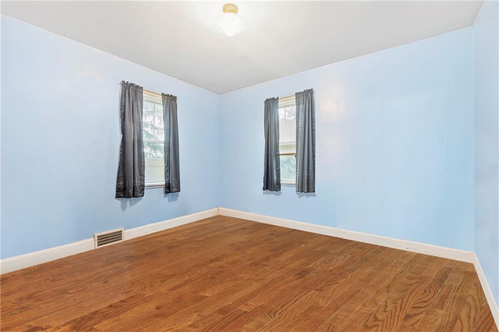 100 Frank Circle Rochester, PA 15074 - Photo 14 of 25 a view of a room with a wooden floor and windows