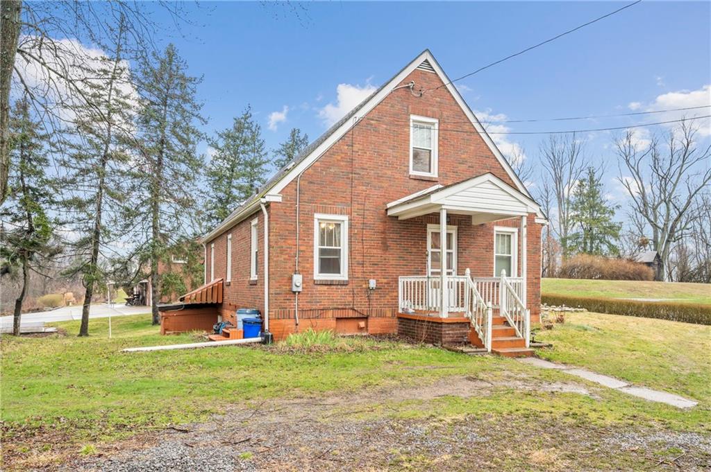 100 Frank Circle Rochester, PA 15074 - Photo 2 of 25 a front view of a house with a yard