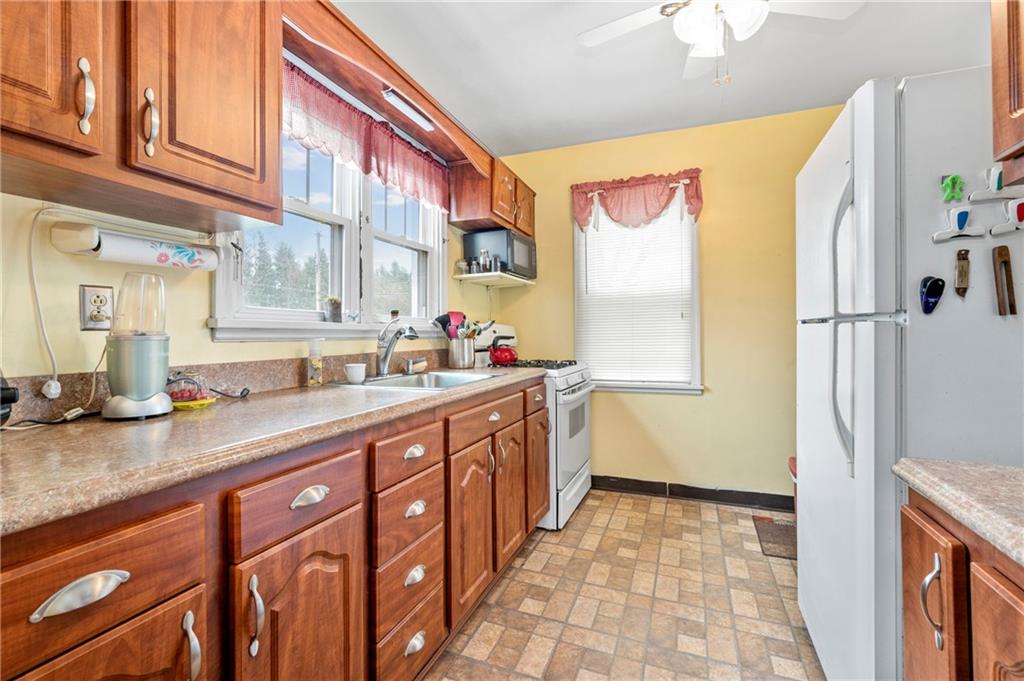 100 Frank Circle Rochester, PA 15074 - Photo 9 of 25 a kitchen with stainless steel appliances a sink and a refrigerator