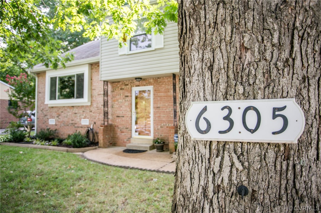 6305 Barrister Road Chesterfield, VA 23832 - Photo 29 of 31 a view of sign board with flower plants