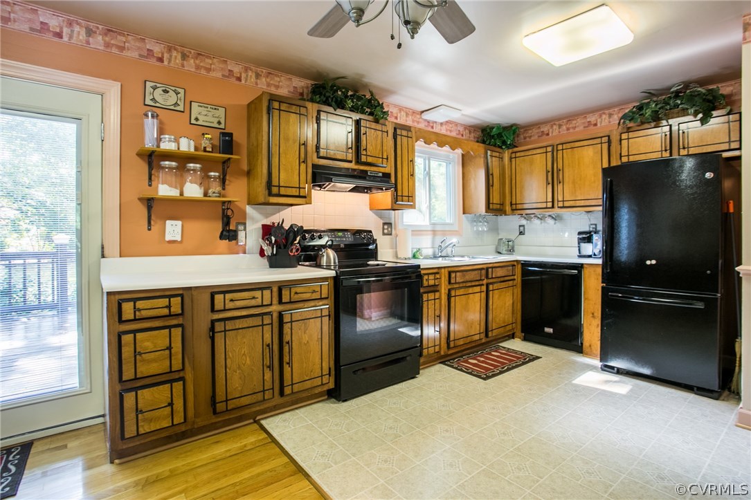 6305 Barrister Road Chesterfield, VA 23832 - Photo 8 of 31 a kitchen with stainless steel appliances granite countertop a stove sink and cabinets