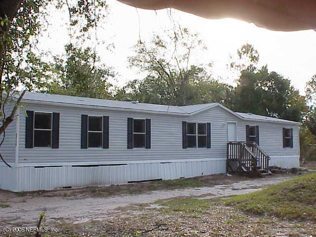a view of a house and a yard