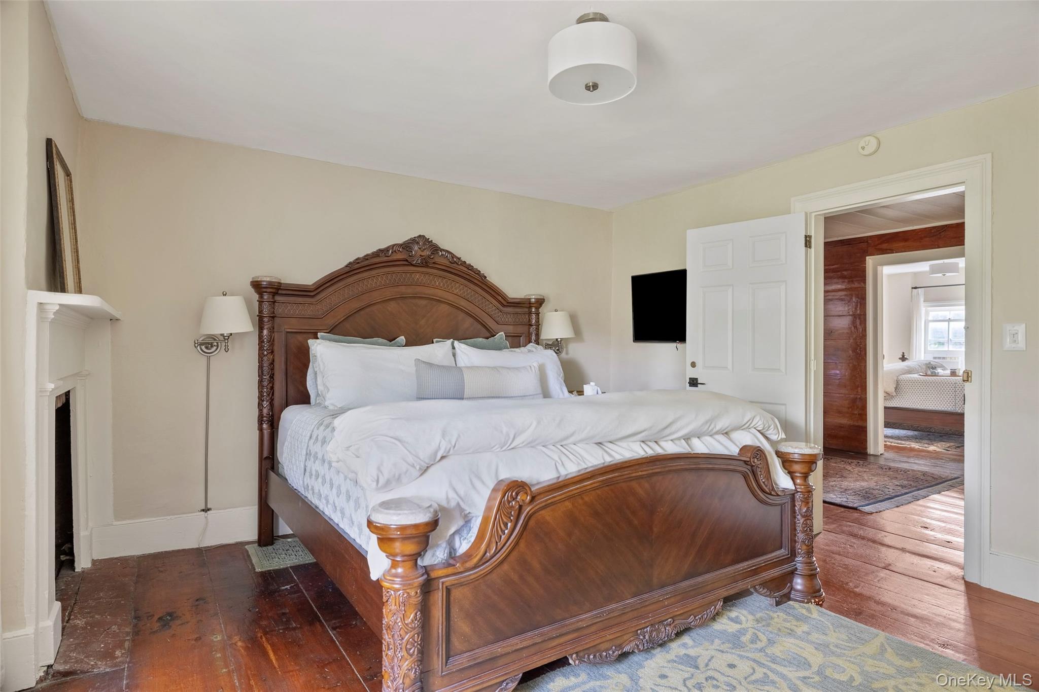 4494-4496 Highway 209 Stone Ridge, NY 12484 - Photo 16 of 48 a bedroom with a bed and wooden floor