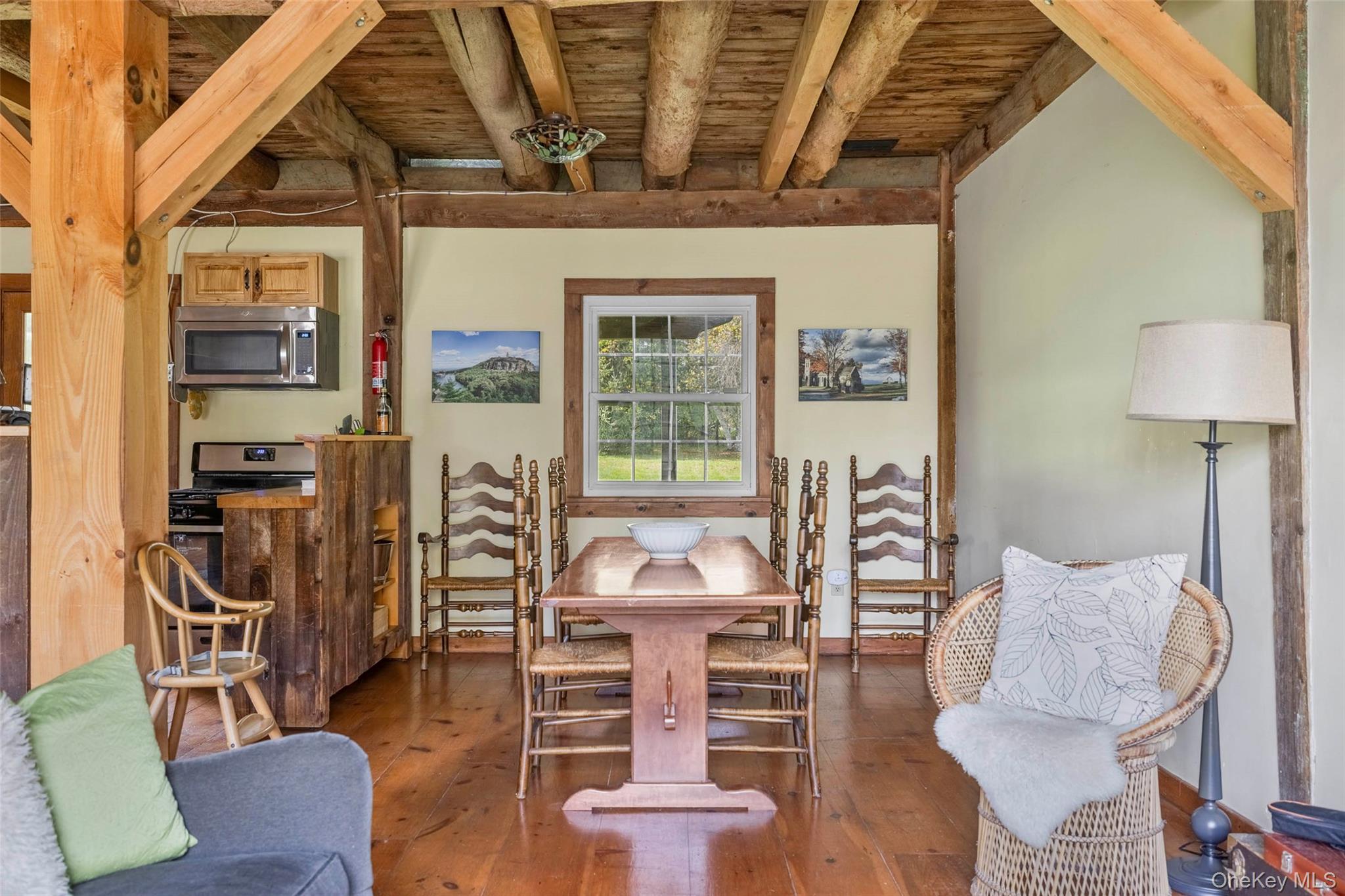 4494-4496 Highway 209 Stone Ridge, NY 12484 - Photo 18 of 48 a view of a livingroom with furniture and a floor to ceiling window
