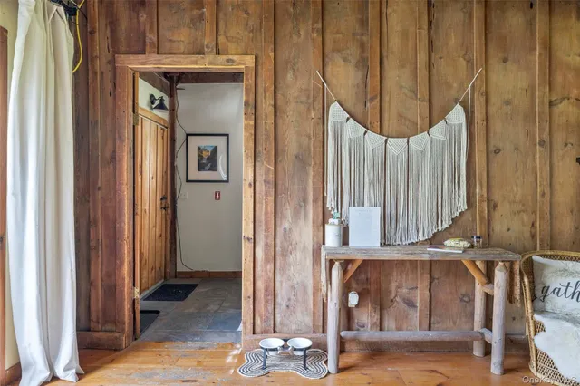 a living room with a flat screen tv and a rug