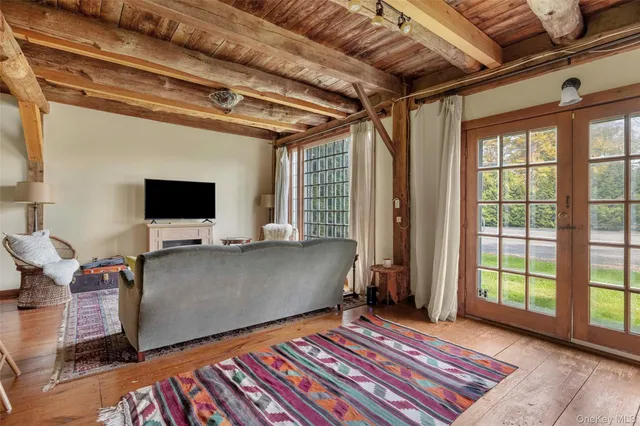a bathroom with a toilet sink a shower and a mirror