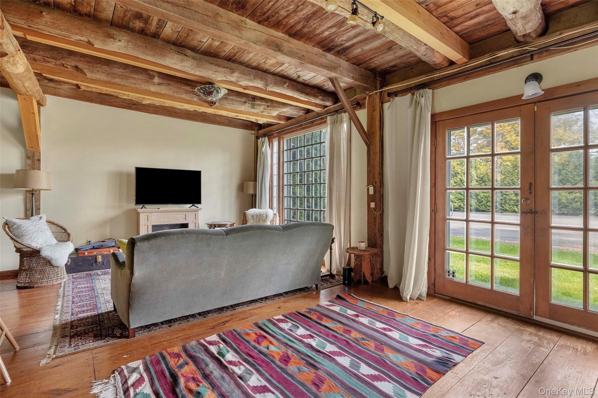 4494-4496 Highway 209 Stone Ridge, NY 12484 - Photo 21 of 48 a living room with a flat screen tv and a rug