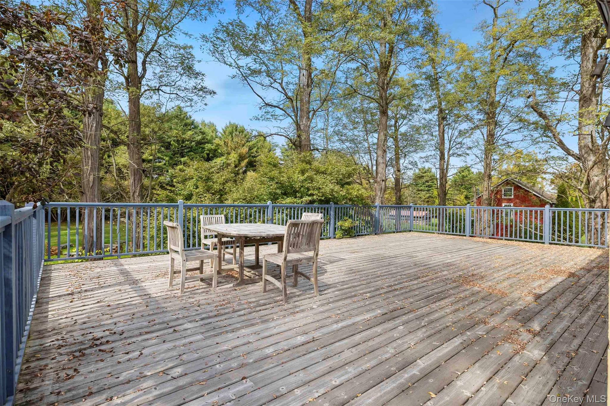 4494-4496 Highway 209 Stone Ridge, NY 12484 - Photo 31 of 48 a view of a table and chairs on the roof deck
