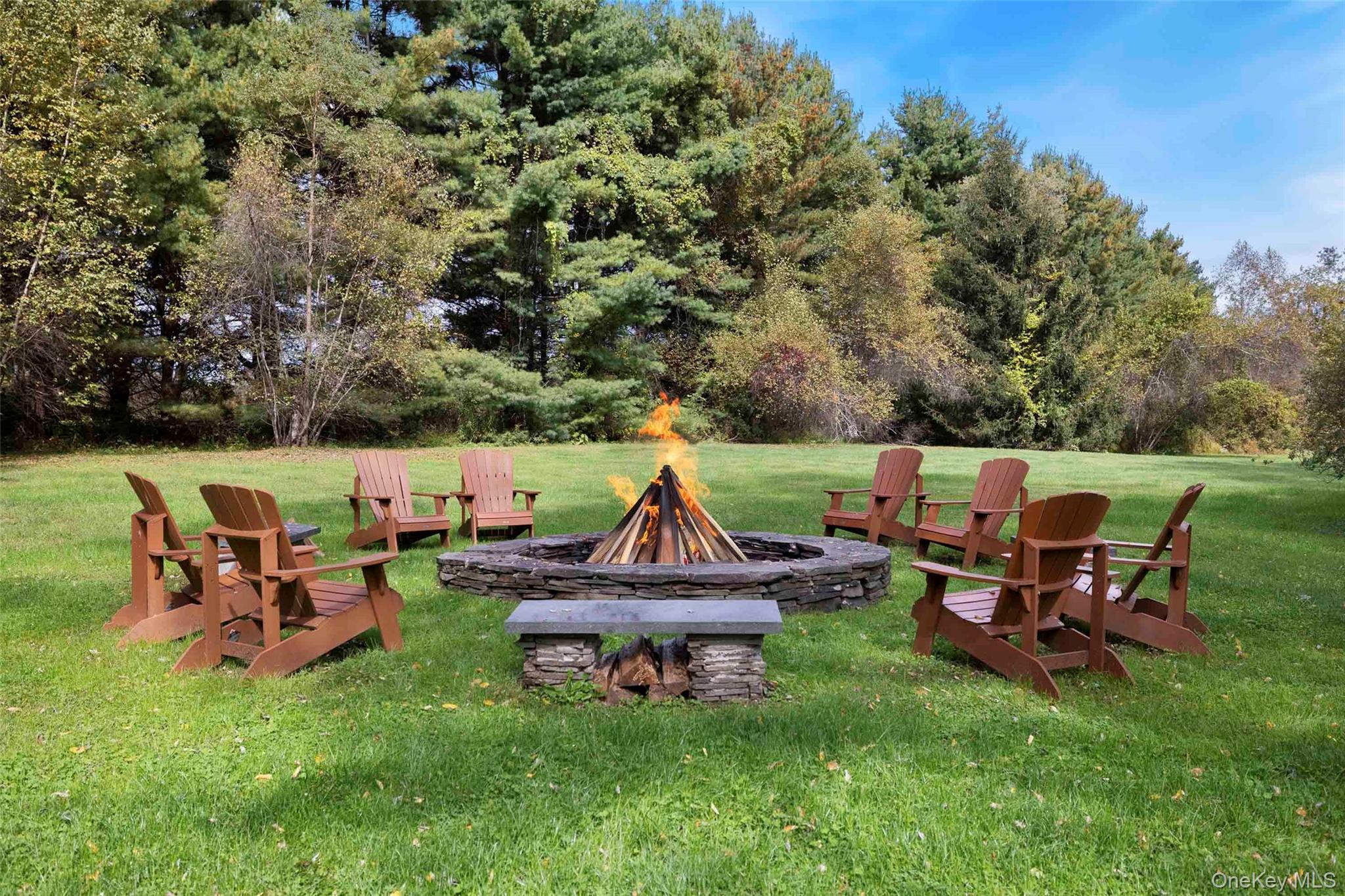 4494-4496 Highway 209 Stone Ridge, NY 12484 - Photo 36 of 48 an outdoor sitting area with chairs and a yard