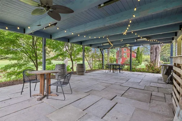 an aerial view of a house with a garden and lake view