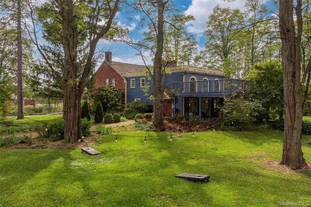 a view of a brick house with a yard