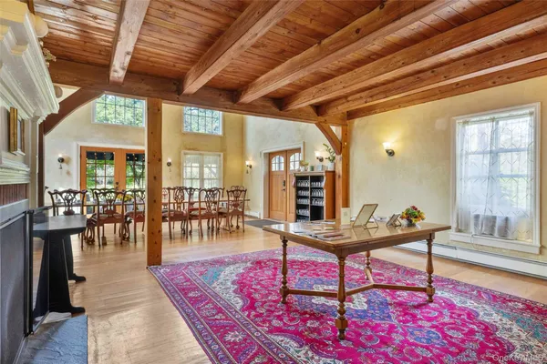 a living room with furniture a wooden floor and a table