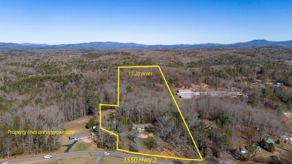 1550 Highway 2 Blue Ridge, GA 30513 - Photo 46 of 46 a view of a lush green hillside and houses