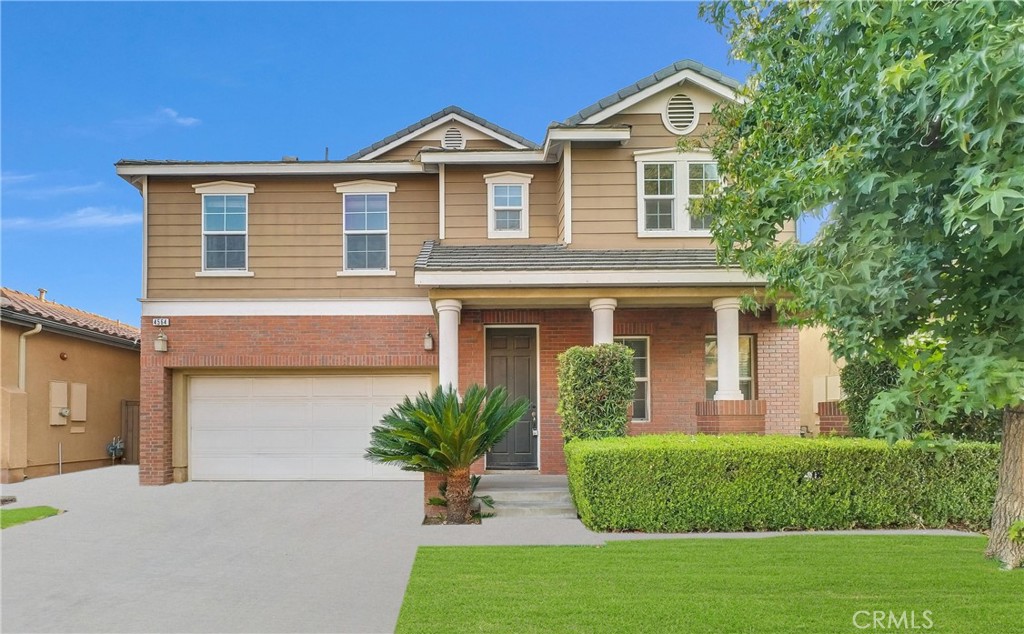 4564 Vincent Way Riverside, CA 92501 - Photo 1 of 1 a front view of a house with a garden and plants