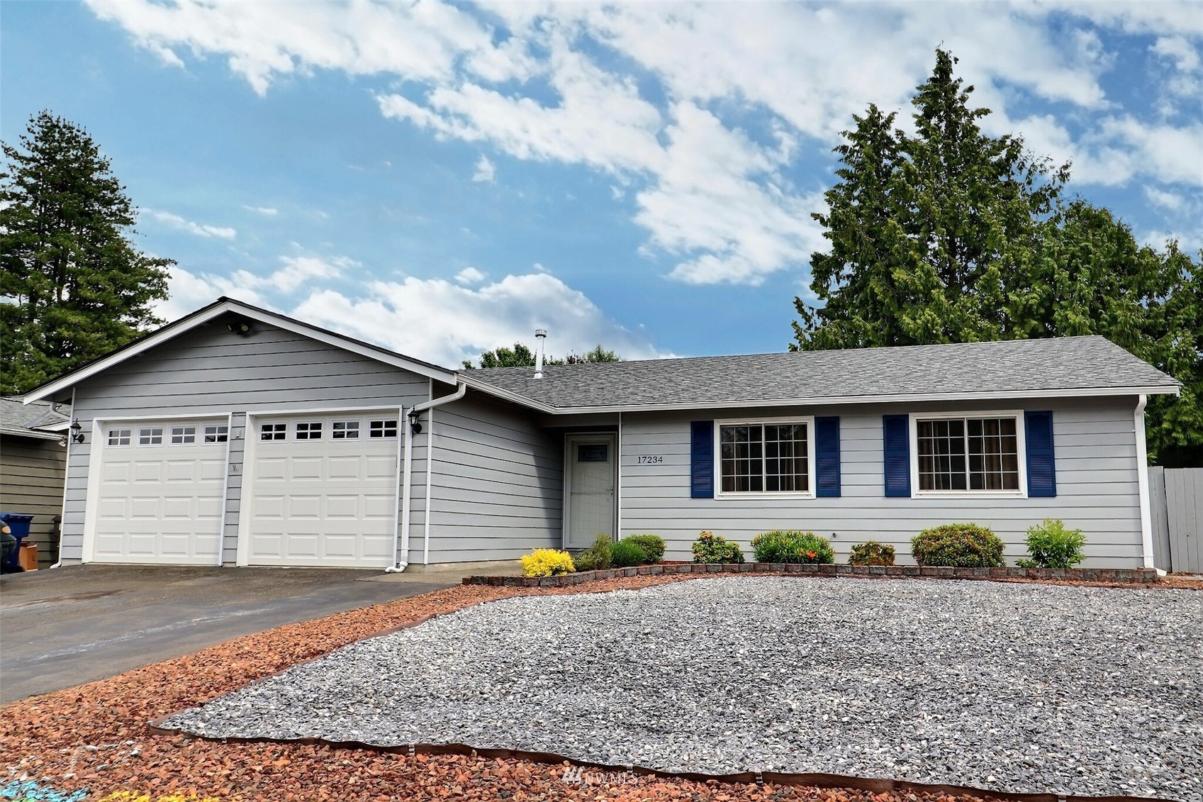 a front view of a house with garden