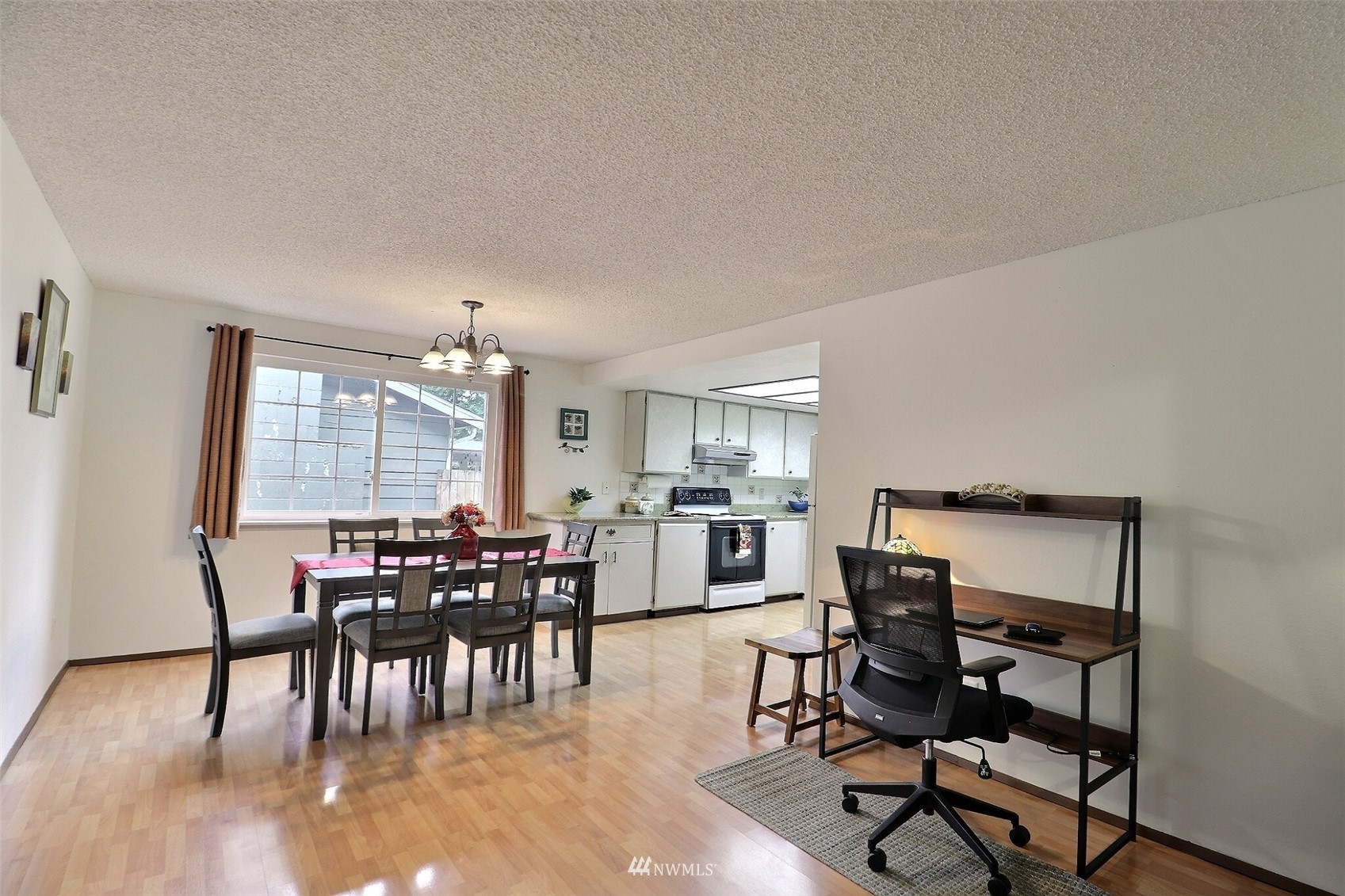 17234 139th Place Southeast Renton, WA 98058 - Photo 15 of 36 a view of a dining room with furniture and window